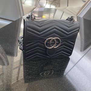 Black leather and metal chain belt bag